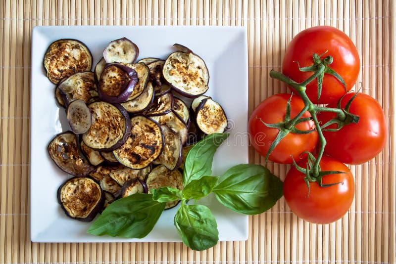 Grilled aubergines with basil and tomatoes