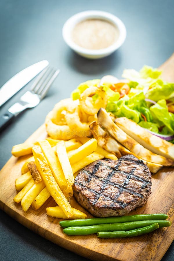 Grilled Beef Meat Steak with French Fries Sauce and Fresh Vegetable ...