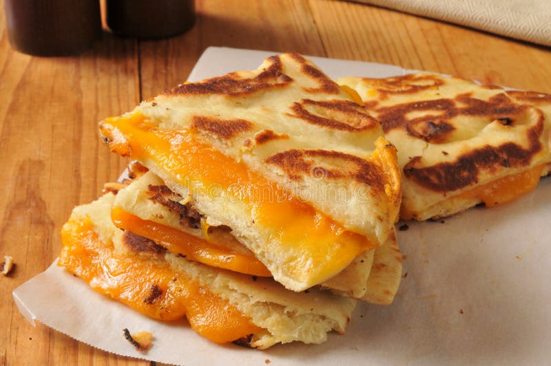 A grilled cheddar cheese sandwich on naan bread. A grilled cheddar cheese sandwich on naan bread