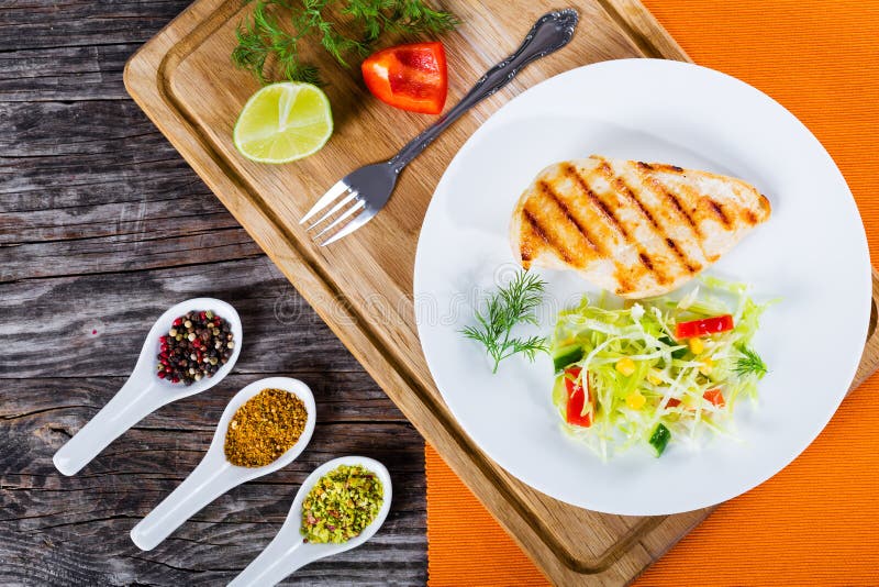 Grilled chicken breast and spring cabbage salad, top view