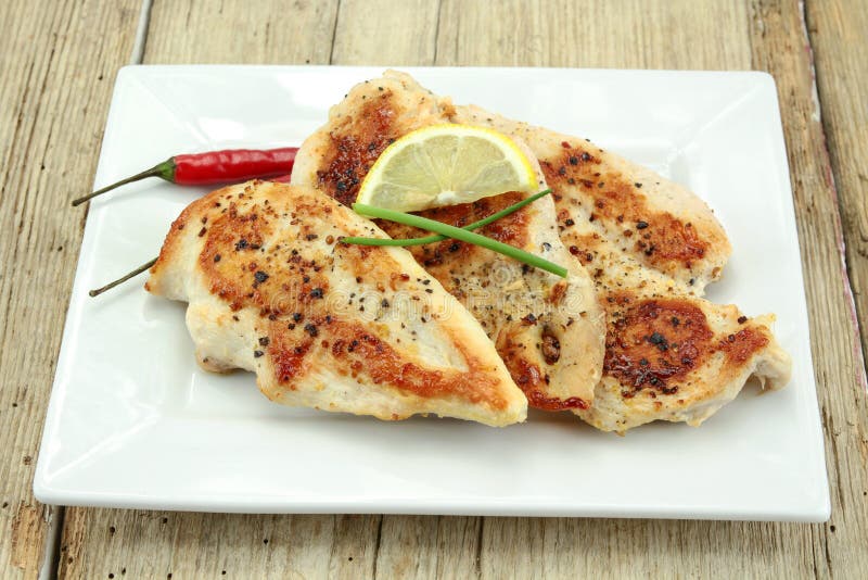 Grilled chicken cutlets stock image. Image of poultry 163962685