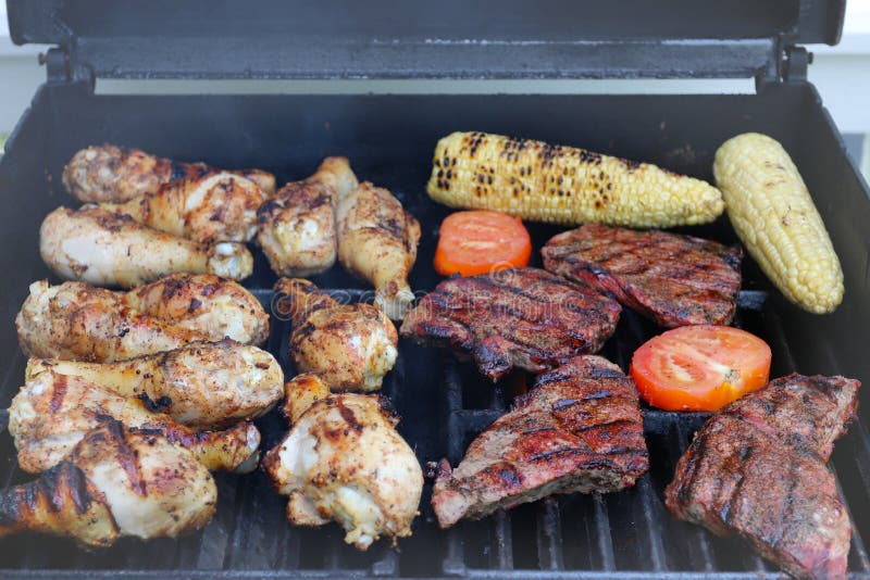 Grilled Chicken Drums with Corn, Stakes and Tomatoes. BBQ Background