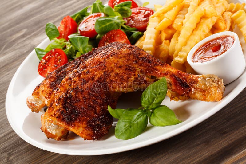 Grilled Chicken Leg with Chips and Vegetables Stock Photo - Image of ...