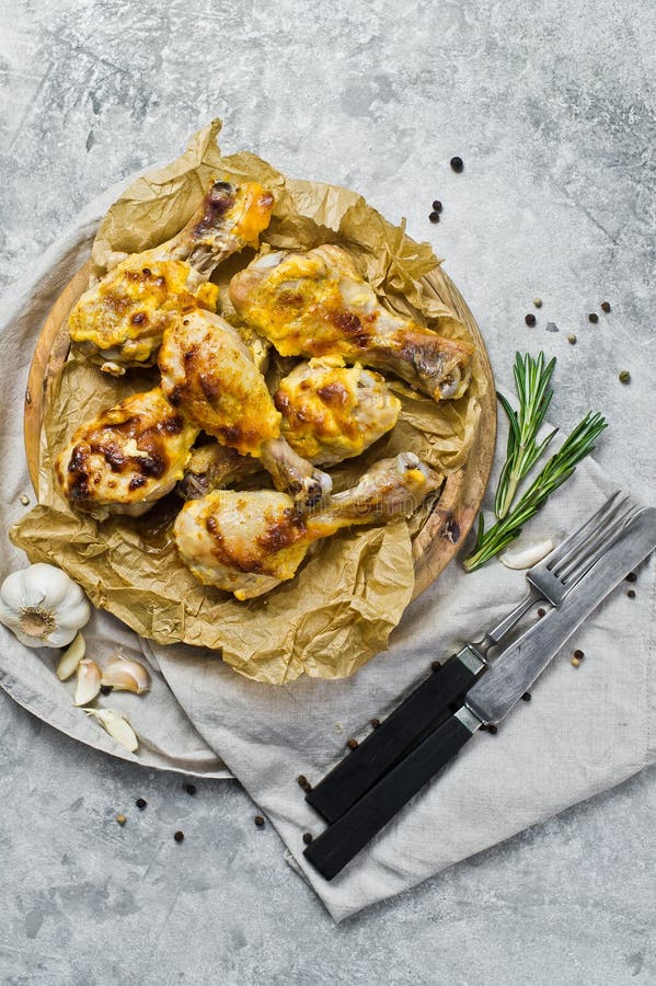 Grilled Chicken Legs on a Tray with Kraft Paper. Gray Background, Top ...