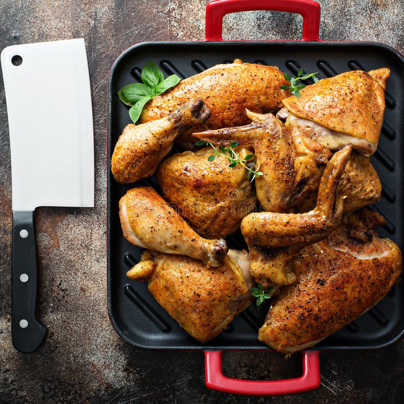 Grilled chicken in a pan stock photo. Image of green 123065642