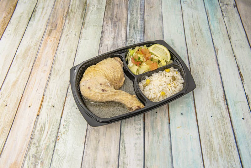 A Grilled Chicken Thigh in Sauce with Rice and Salad Stock Image