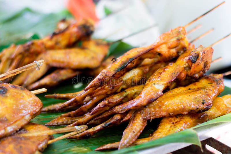 Grilled Chicken Wings on banana leaf, Thai style food. Thai traditional menu - Thai street food. royalty free stock images Grilled Chicken Wings on banana leaf, Thai style food. Thai traditional menu - Thai street food. royalty free stock images