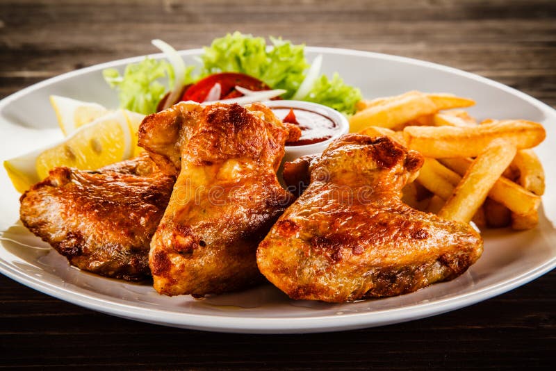 Grilled Chicken Wings, Chips and Vegetables Stock Image - Image of ...