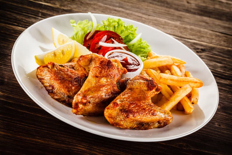 Grilled Chicken Wings, Chips and Vegetables Stock Image - Image of ...