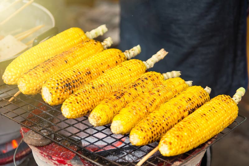 Grilled Corn on the Hot Stove in the Market,Thailand. Stock Photo