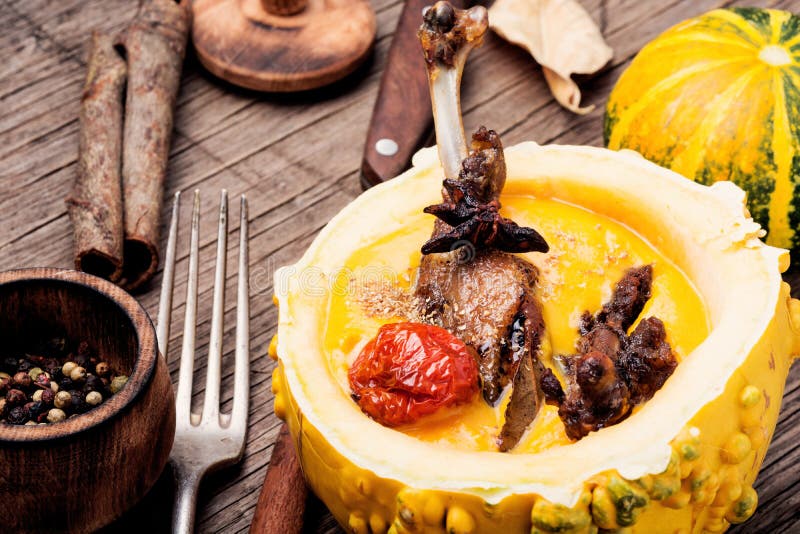 Baked duck leg in pumpkin puree royalty free stock photo Baked duck leg in pumpkin puree royalty free stock photo