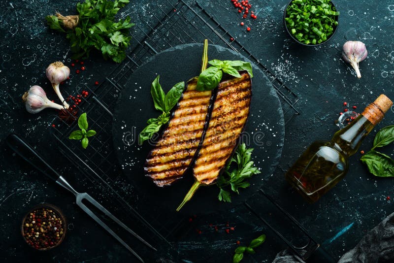 Grilled Eggplant with Basil on a Black Stone Plate. Stock Image Image