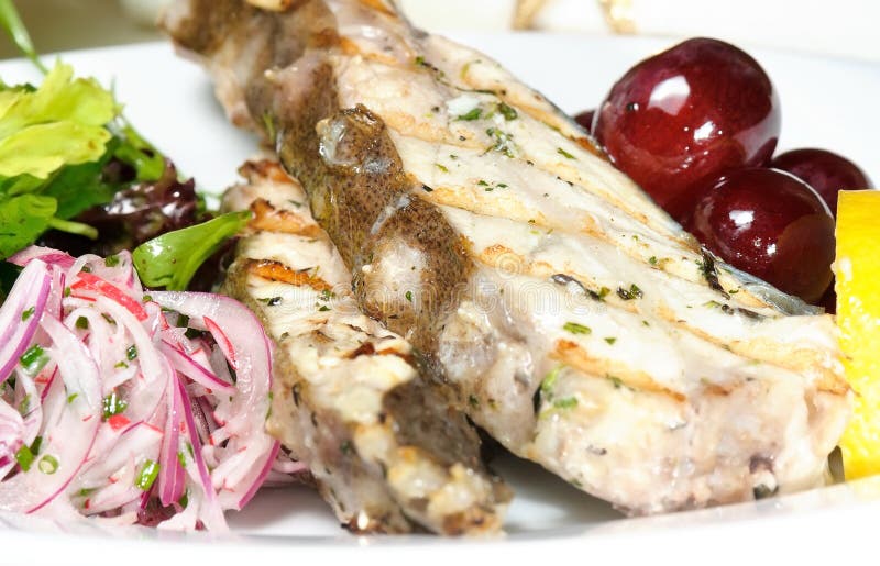 Grilled fish with grapes stock image. Image of appetizing 36815103