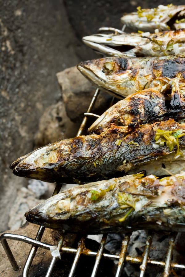 Grilled fishes on hot grill