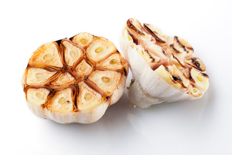 Grilled garlic isolated on white stock image