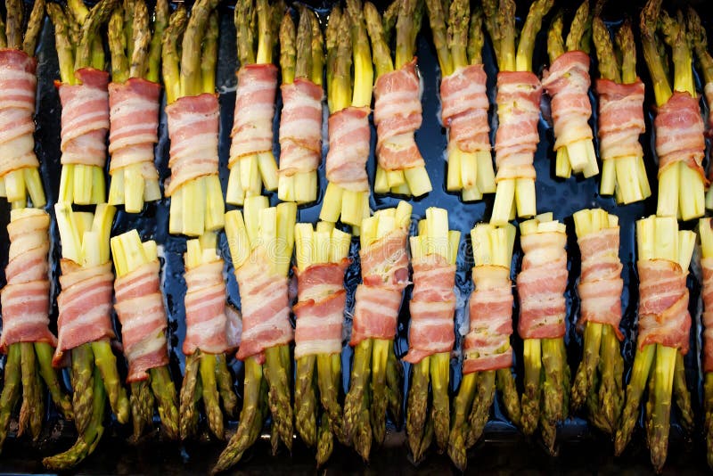 Grilled green asparagus wrapped with bacon royalty free stock photos Grilled green asparagus wrapped with bacon royalty free stock photos