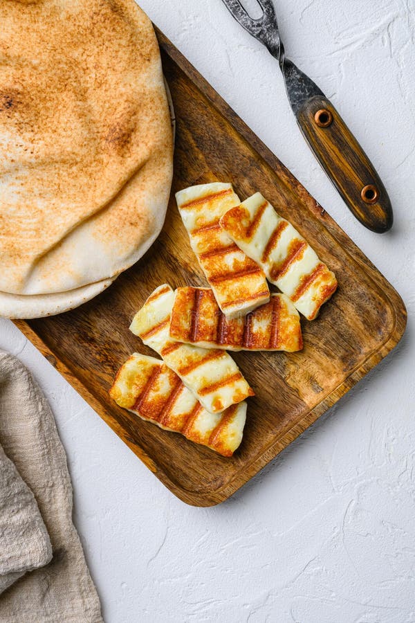 Grilled Halloumi, Fried Cheese, on White Stone Table Background, Top View Flat Lay Stock Photo