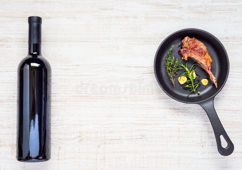 Grilled Lamb Chop with Bottle Red Wine and Copy Space Stock Image