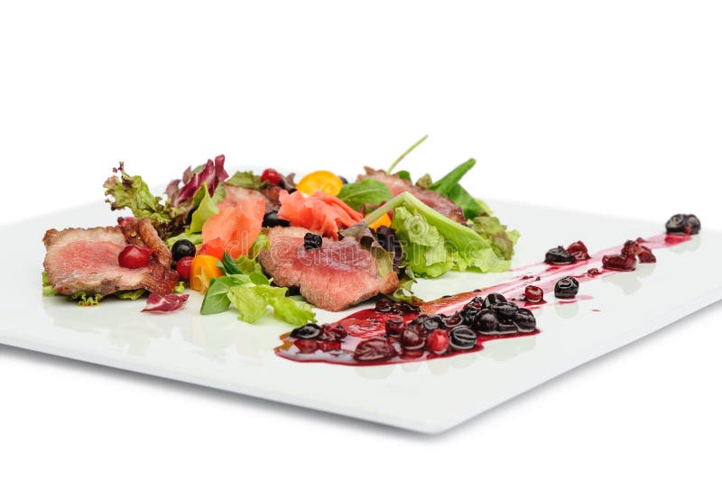 Grilled meat with cranberry and blackcurrant sauce