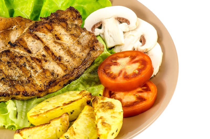 Grilled Meat Dish with Tomato, Potatoes and Mushrooms Stock Image