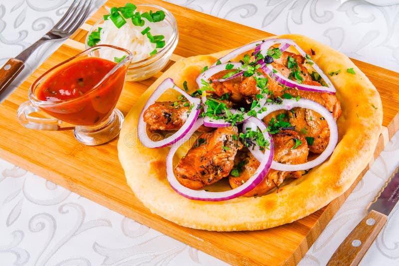 Grilled meat on pita bread stock image. Image of onion 115525745