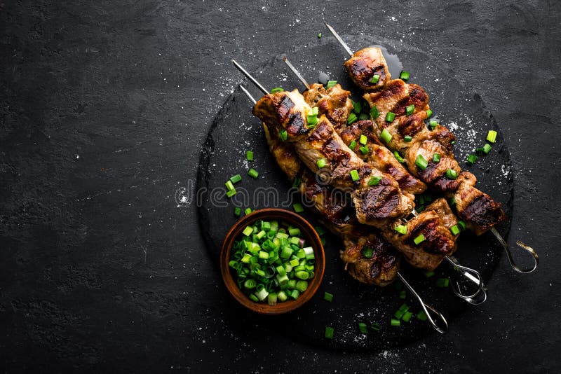 Shish kebab of meat skewered on a grill close-up outdoors Stock Photo -  Alamy