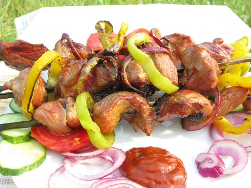 Grilled meat with vegetables stock images