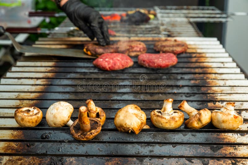 Grilled mushrooms with meat on the stove stock image Grilled mushrooms with meat on the stove stock image