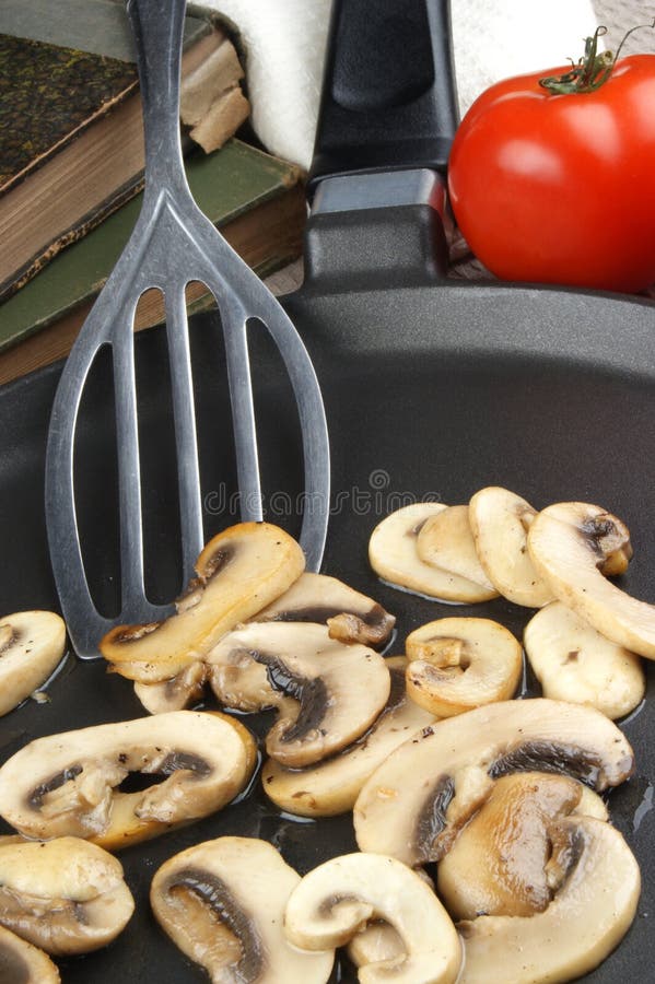 Grilled mushrooms in a pan stock image. Image of nutritious 20627061
