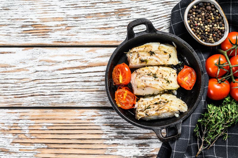Grilled Pollock or Coalfish Fillets in a Pan. White Background. Top