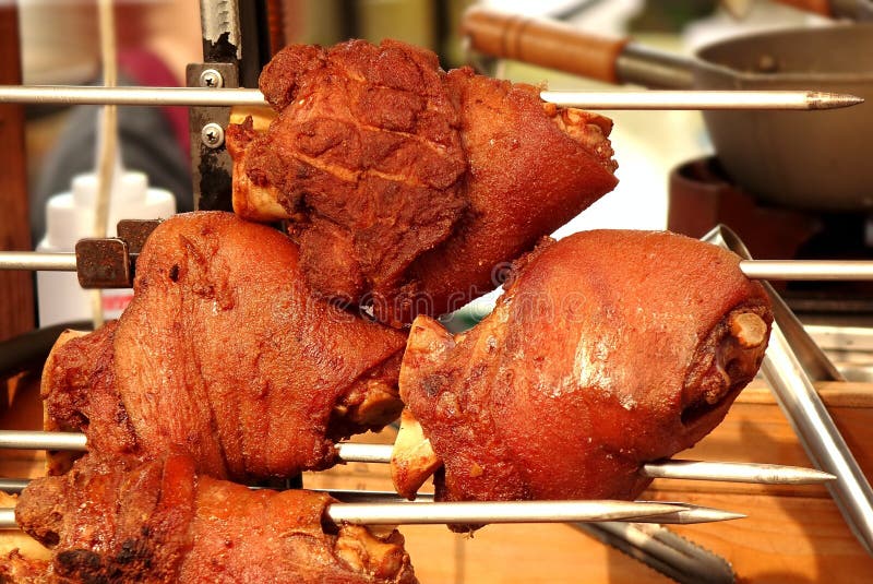 Grilled Pork Knuckles on a Spit stock images Grilled Pork Knuckles on a Spit stock images