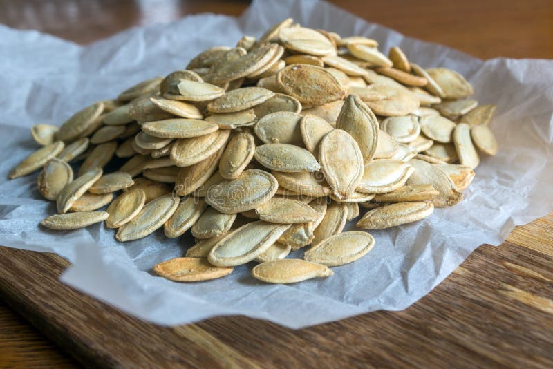 Grilled Pumpkin seeds with sea salt and spices. Products, autumn.