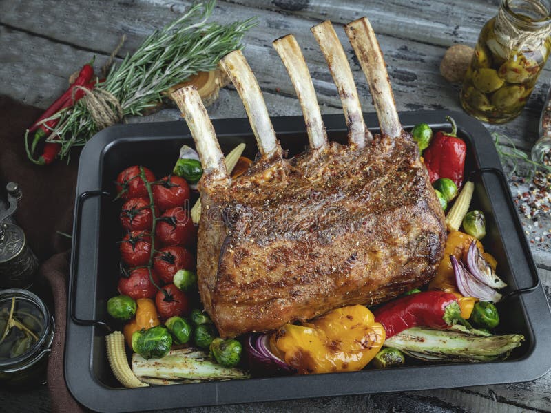 Grilled Roasted Rack of Lamb, with Vegetables on the Baking Sheet Stock