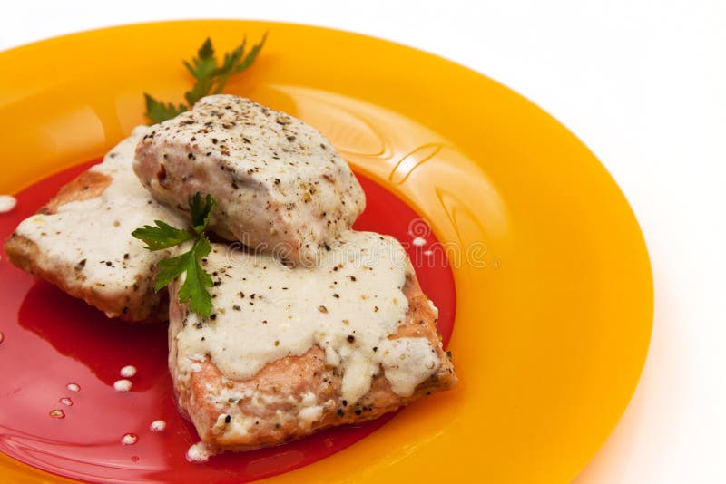 Grilled salmon with cream sauce and parsley