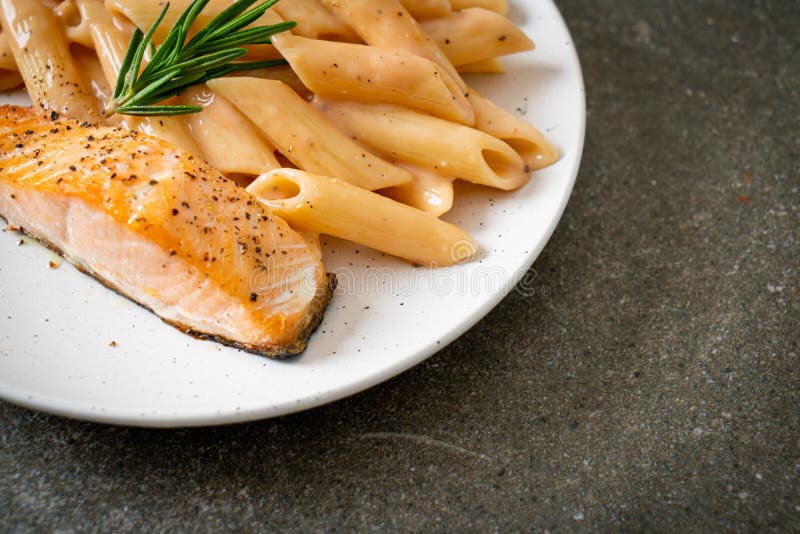 Salmon with Penne Pasta Cream Sauce Stock Image - Image of cooking ...