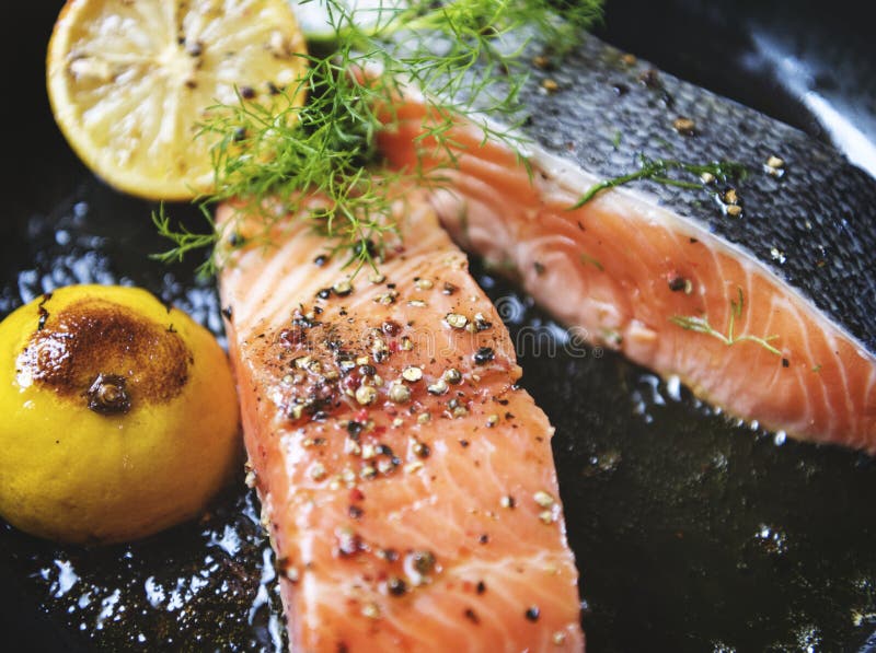 Grilled salmon fillet sprinkled with salt and pepper