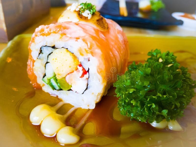 Grilled salmon sushi roll with parsley.sushi menu. Japanese food stock photos Grilled salmon sushi roll with parsley.sushi menu. Japanese food stock photos