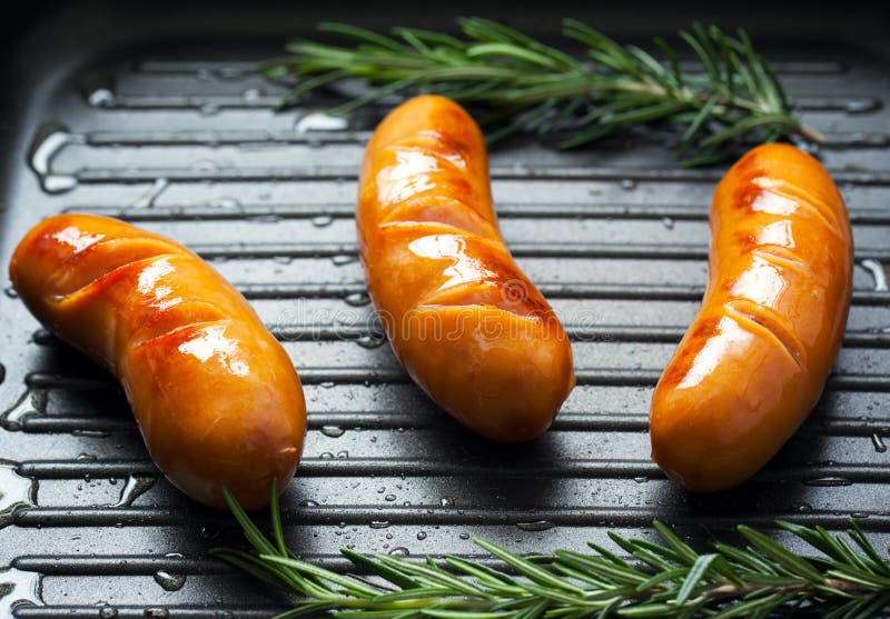 Grilled sausage in pan stock photo. Image of food, grilled 63504460