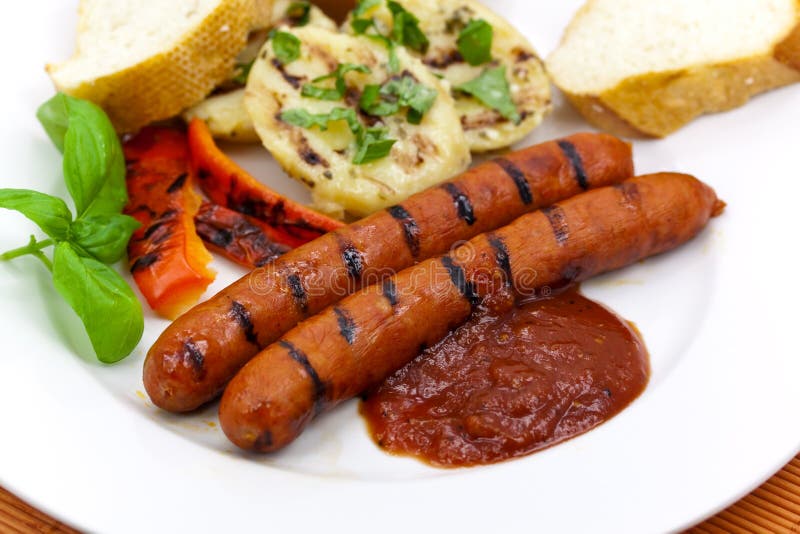 Grilled sausage with potato and baguette