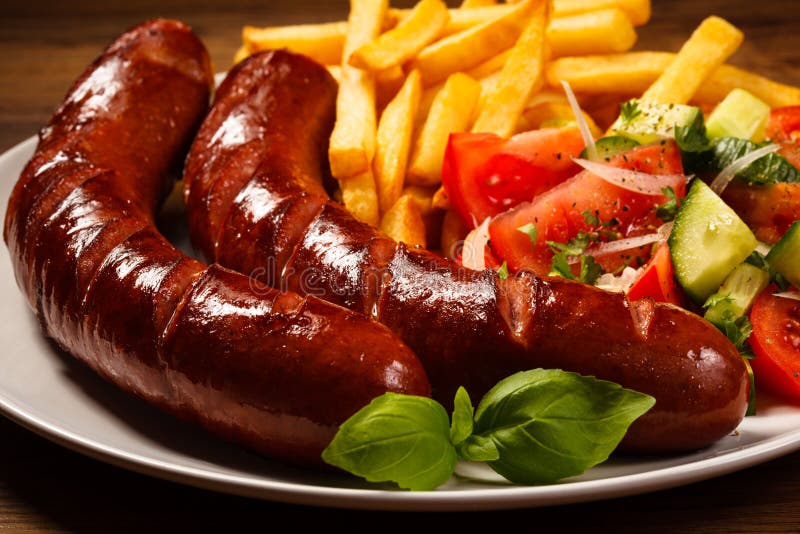 Grilled Sausages, Chips and Vegetable Salad Stock Image Image of