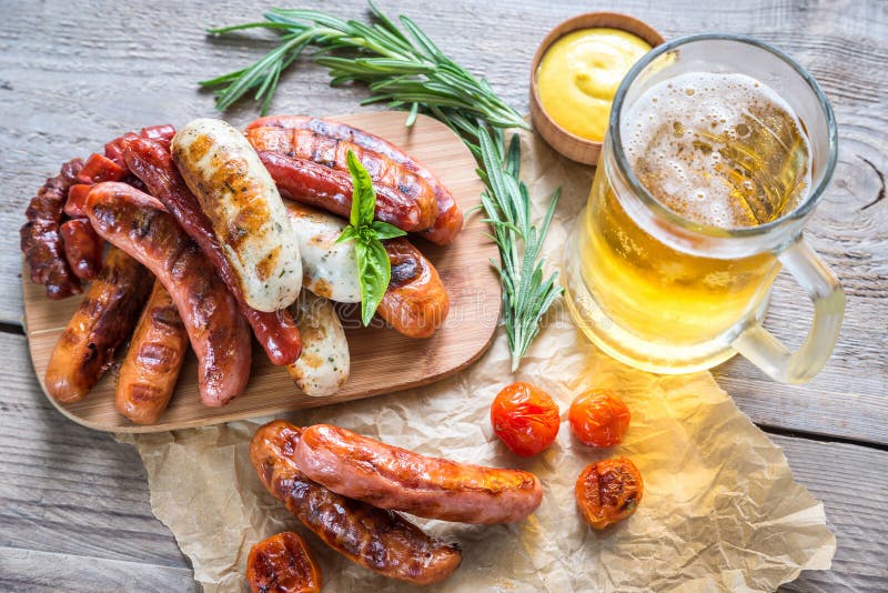 Grilled sausages with glass of beer