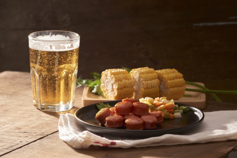 Grilled sausages with glass of beer on wooden table with copy sp royalty free stock photo Grilled sausages with glass of beer on wooden table with copy sp royalty free stock photo