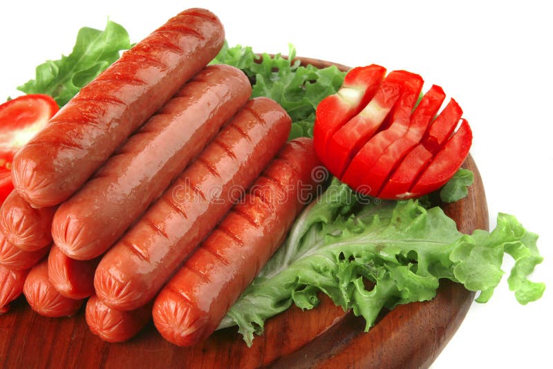 Grilled sausages served on wood stock photography