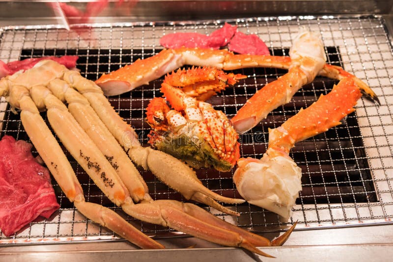 delicious grilled seafood platter, King crab legs and beeg