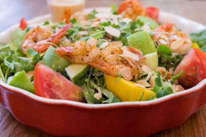 Download Fresh Salad Bowl With Shrimp Tomato Apple And Mixed Greens Salad On Wooden Table Background Stock Image Image Of Nuts Leaf 153564125 Yellowimages Mockups