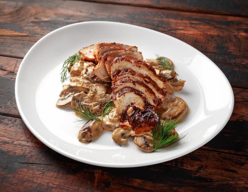 Grilled slices Chicken Breast with Creamy Mushroom Sauce. healthy food.