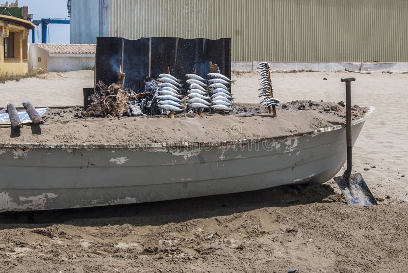 Grilled Spanish Sardines in a Boat in the Beach. Andalucia Stock Photo