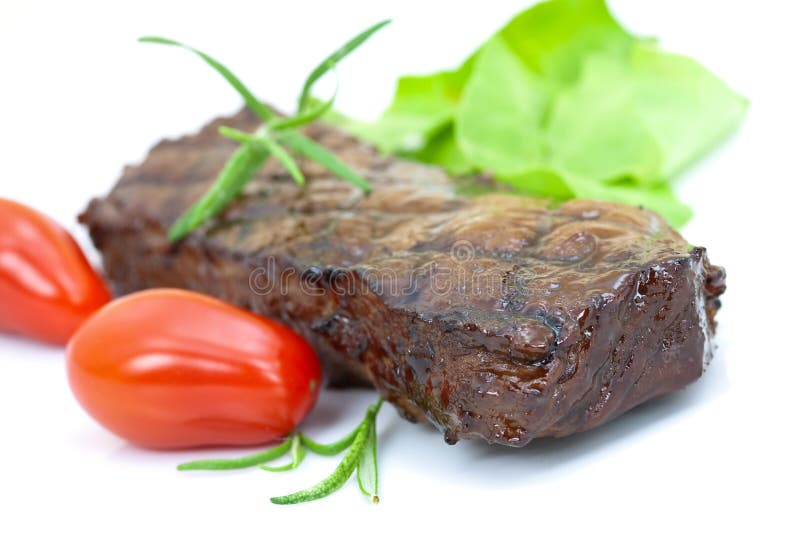 Grilled strip steak with tomato and salad