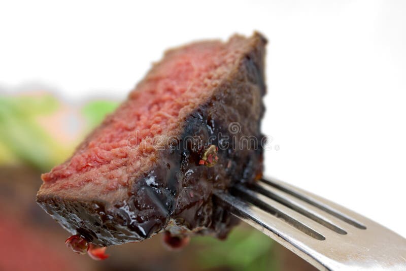 Grilled strip steak with tomato and salad