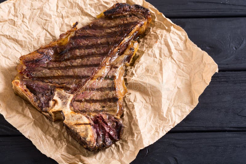 Grilled Tbone steak meat stock photo. Image of metal 148822964